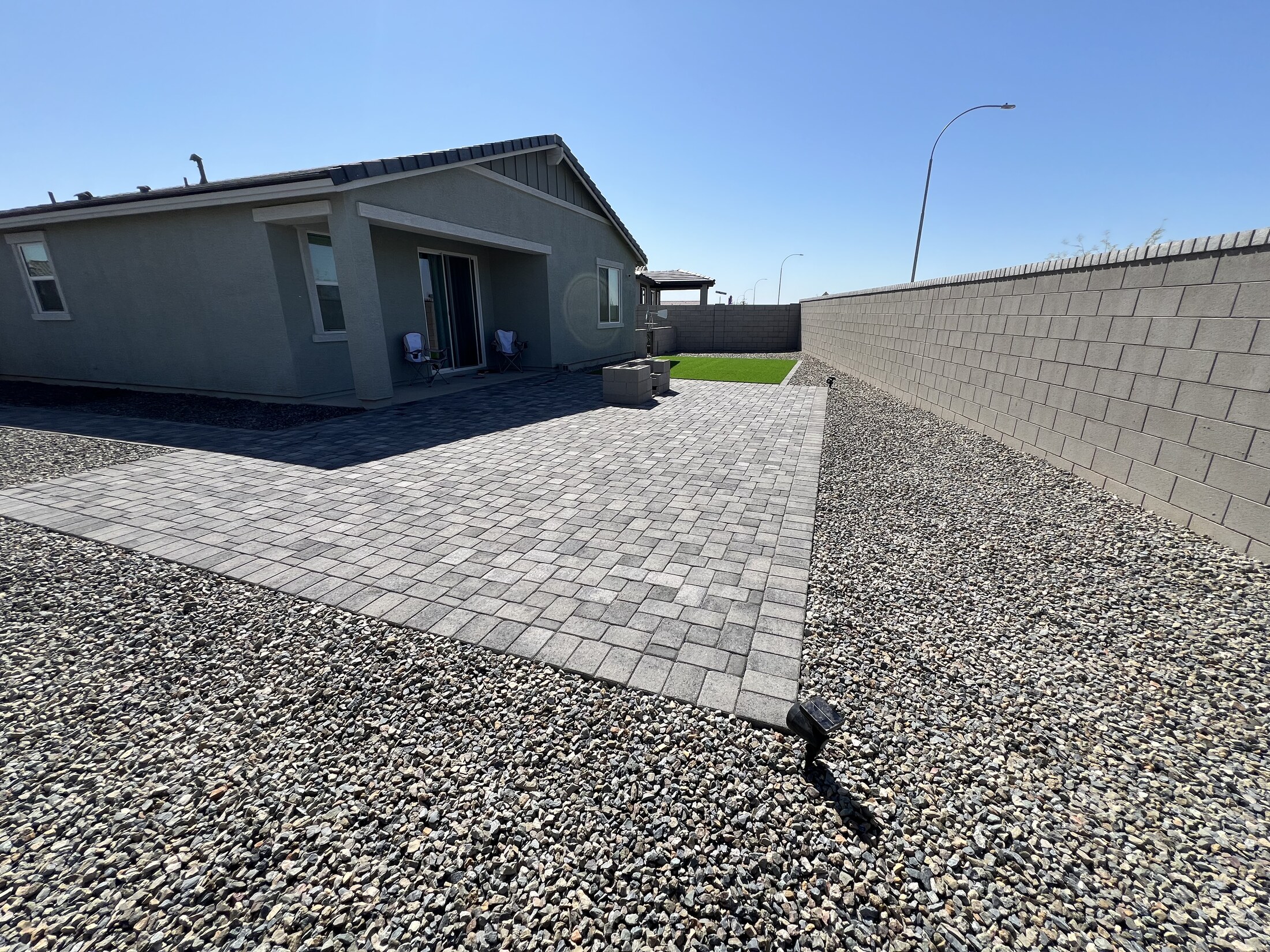 Backyard hardscape with a lot of usable space